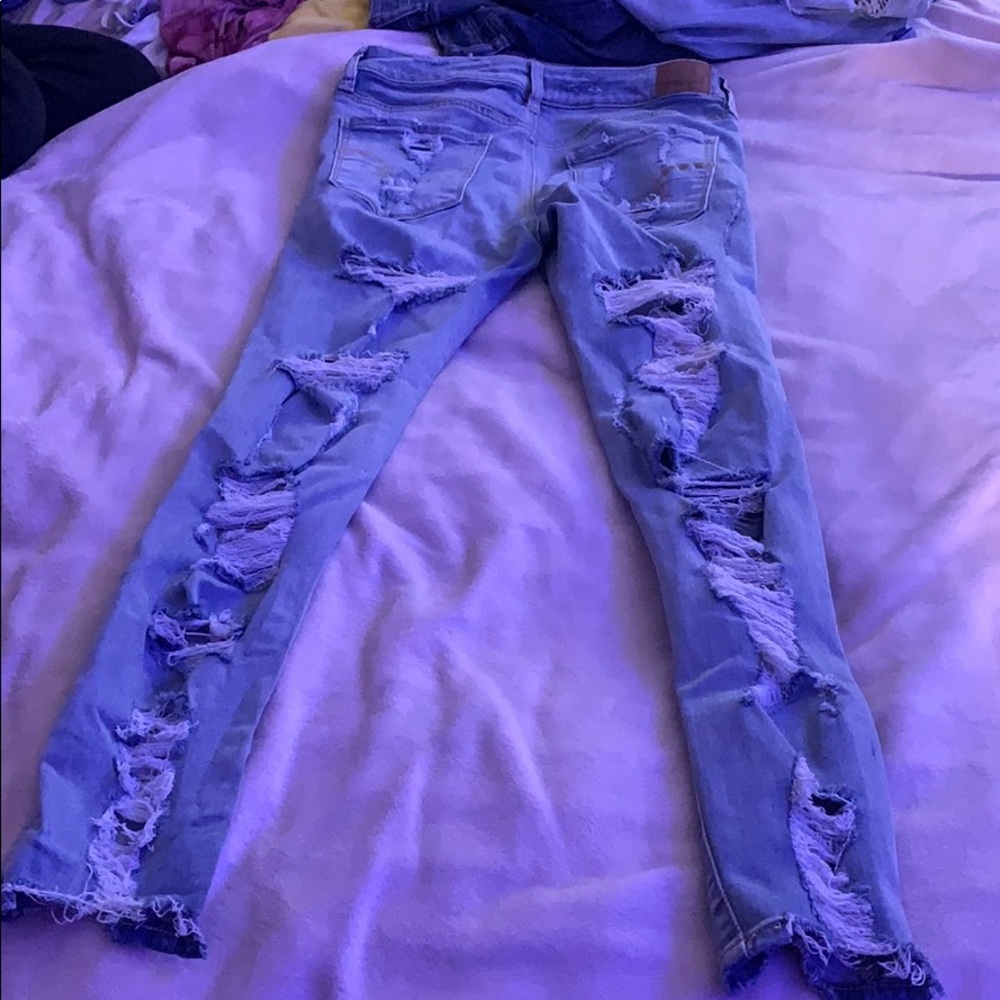 Light wash jeans high rise ripped on front/back